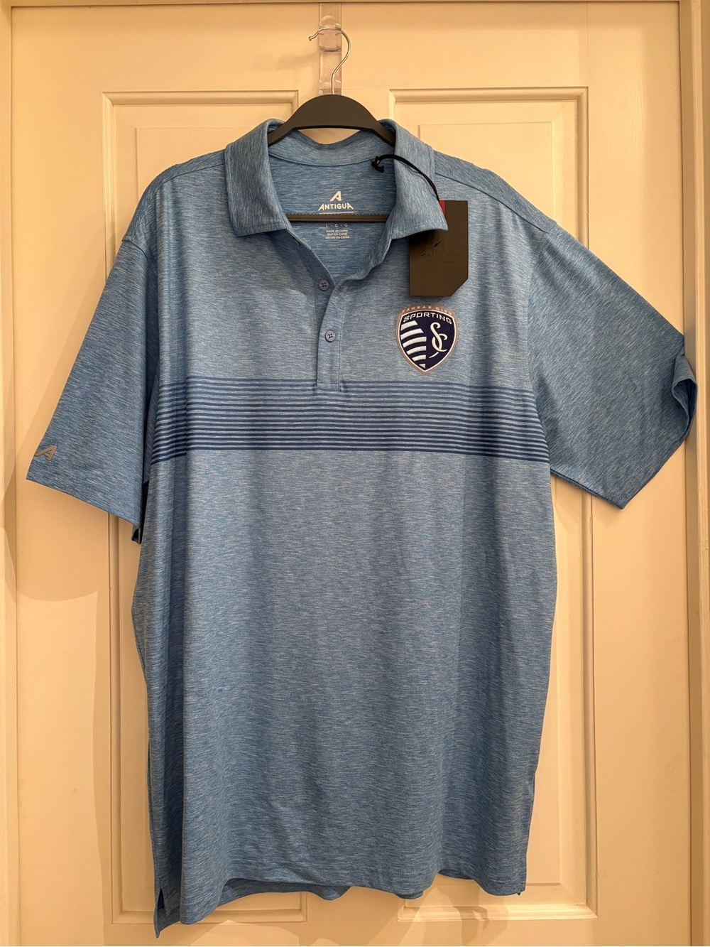 Antigua Kansas City Men's Heather Light Blue Polo with Sporting Crest